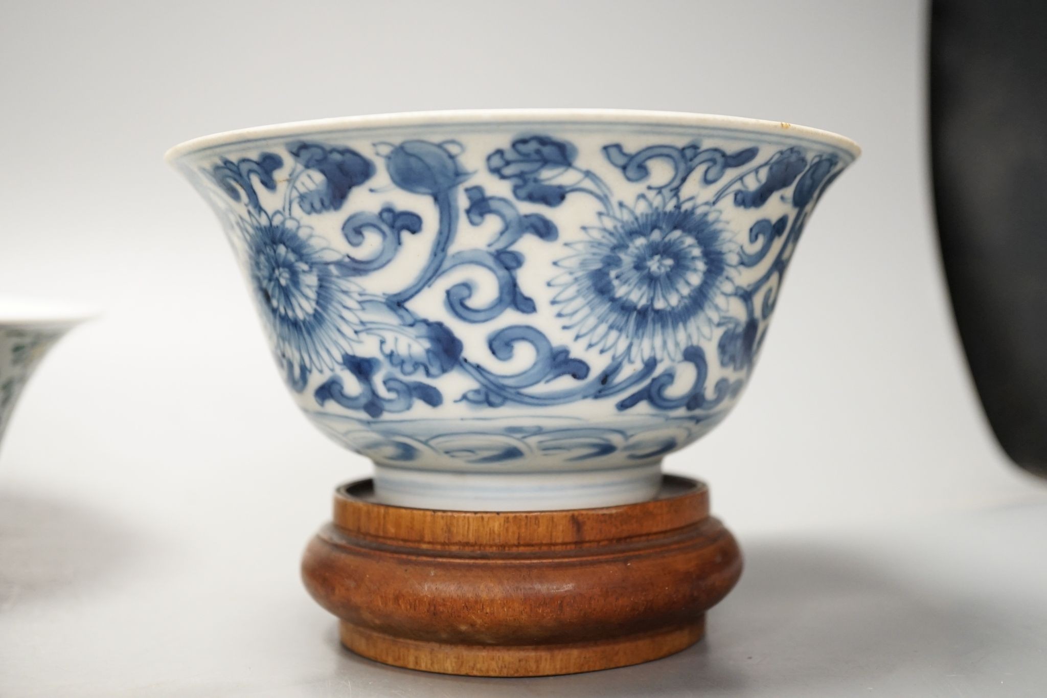 A Chinese blue and white bowl, Kangxi, 15cm. diam., a famille rose teapot stand, Yongzheng, and two doucai bowls